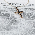 Revelation of the Savior image showing the book of revelation and the cross