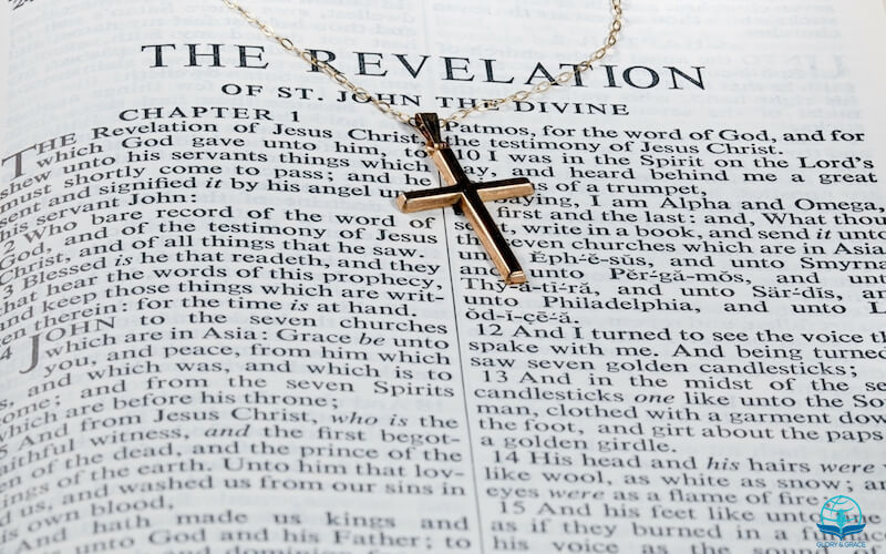 Revelation of the Savior image showing the book of revelation and the cross
