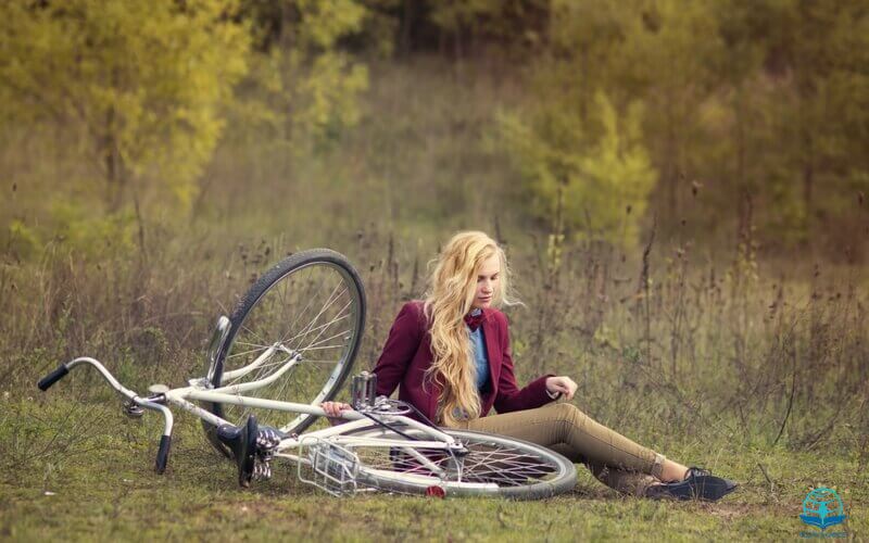 The Lord had given him rest showing a woman resting besides her bicycle