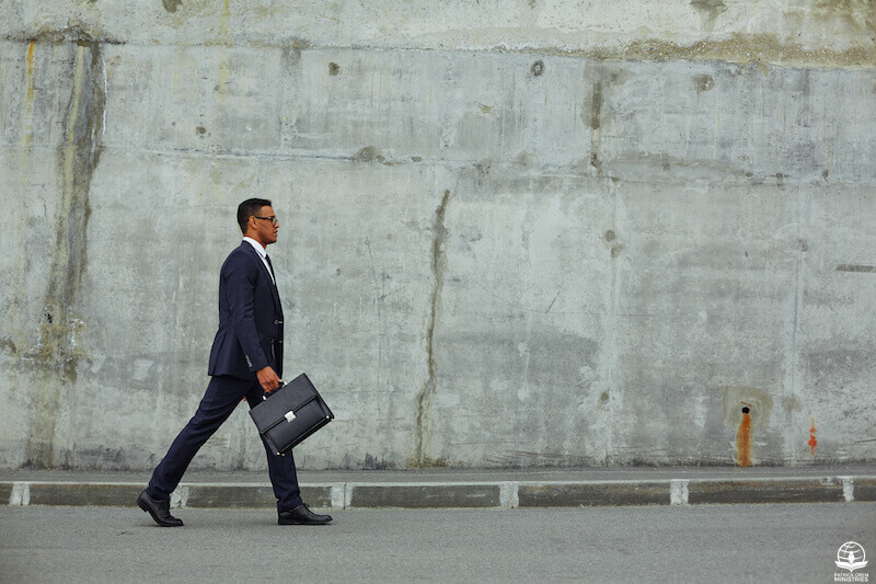 Walking in the Spirit showing a man waking with a briefcase