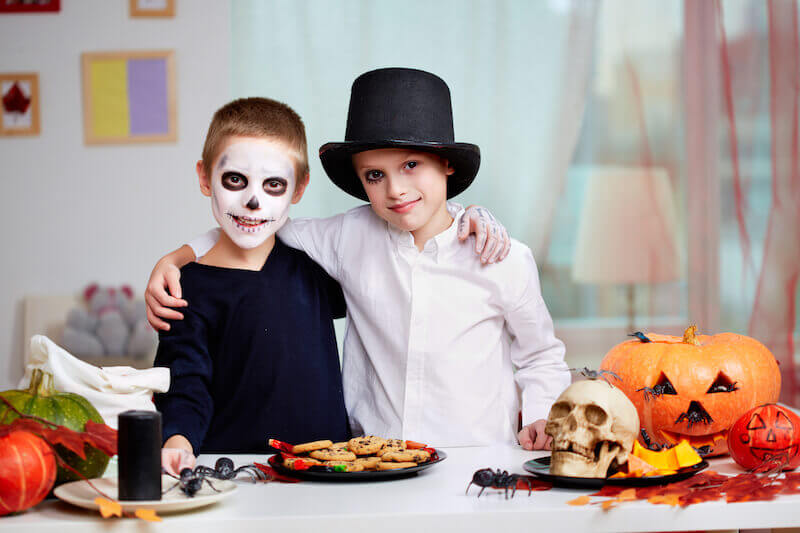 spirit of antichrist showing two kids celebrating halloween