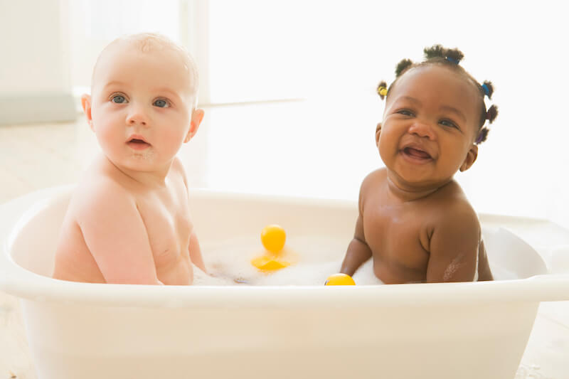 Washing of regeneration showing two babies in the bathtub