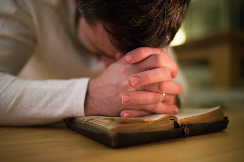 Devotional life showing a man praying