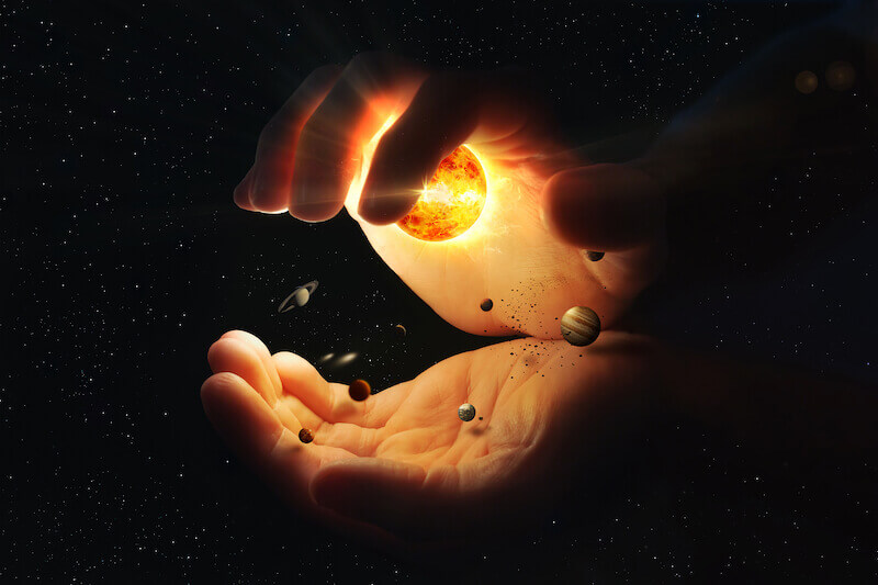 The anointing showing two hands holding the universe