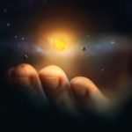 What holds the universe? picture of a hand holding the galaxies