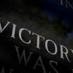 victory showing the letters of the word in a dark background