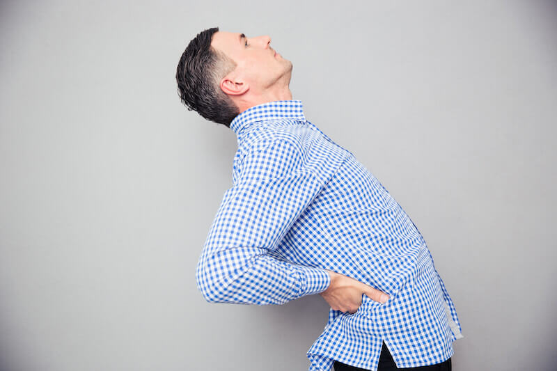 Spirit will quicken our bodies showing a man with back pain