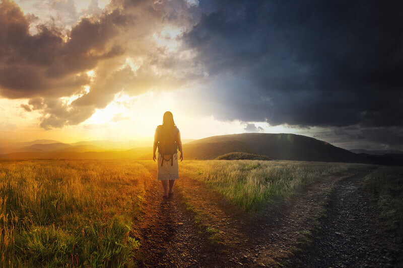 What does it mean to live in the glory showing a woman walking in the light