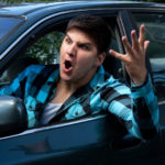 fool gives full vent to his anger showing a man on the road