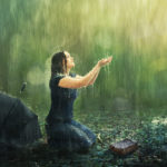 let us cleanse ourselves from all defilement of body and spirit showing a woman under the rain