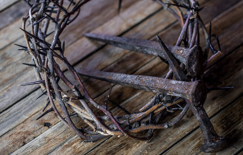 he was wounded for our transgressions showing crown of thorns and nails 