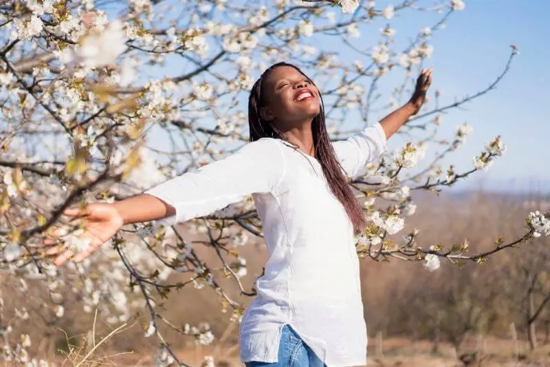 joy of the Lord is our strength showing a joyful woman