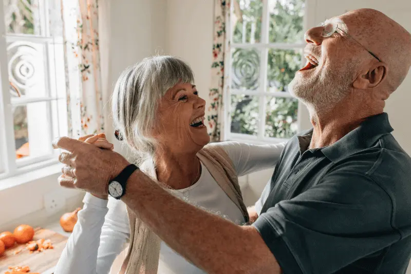 Your joy no man takes away showing an elderly man dancing with wife